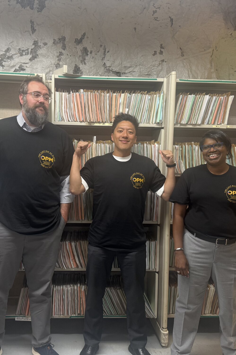 Career staff and a GovMaxxing operator standing together after collaborative delivery work