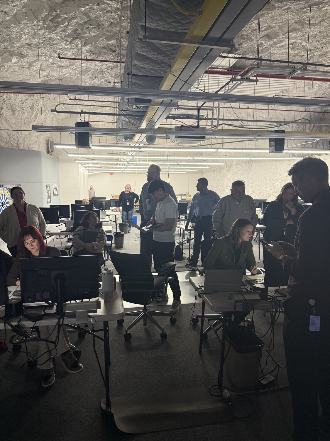 Public-sector staff and GovMaxxing operators working together in a shared delivery space